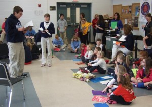 Dominick Thomas as the Wizard and Rachel Harper as Dorothy rehearse their lines for the spring musical “The Wizard of Oz.” Watching intently are the grade school students who will participate in the play as Munchkins. 
