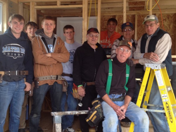 Building Trades class along with the help of some volunteers prepare Santa's Hut for the community.