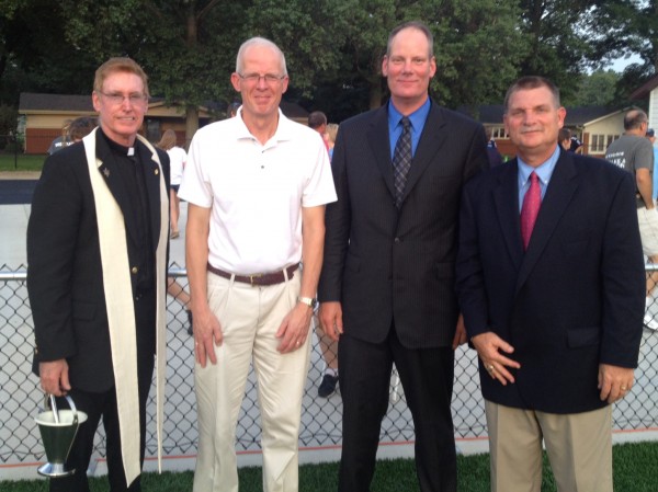 Father Chuck Tuttle, Mr. Tom Rehkemper, Mr. John Wieter, and Principal Dennis Litteken participated in the blessing and dedication of the new athletic field.